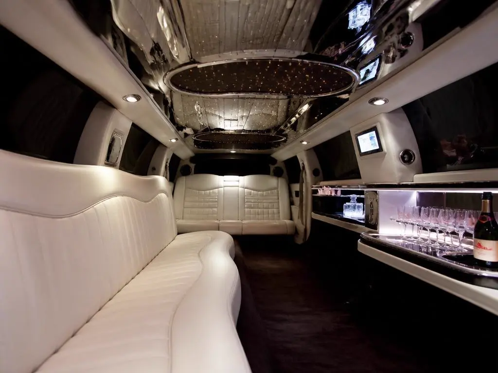 Elegant stretch limousine interior with leather seating and ambient lighting